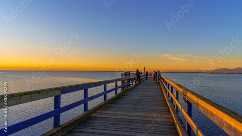 Sunset at public fishing pier on Boundary Bay  BC  early winter