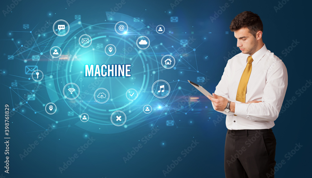 Businessman thinking in front of technology related icons and MACHINE inscription, modern technology concept Businessman thinking in front of technology related icons and MACHINE inscription, modern technology concept
