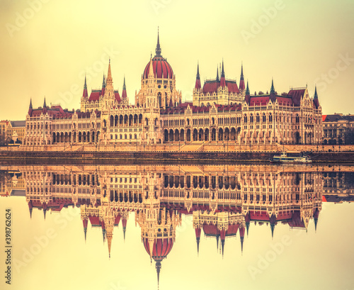 Hungarian Parliament with reflection at sunrise. Budapest