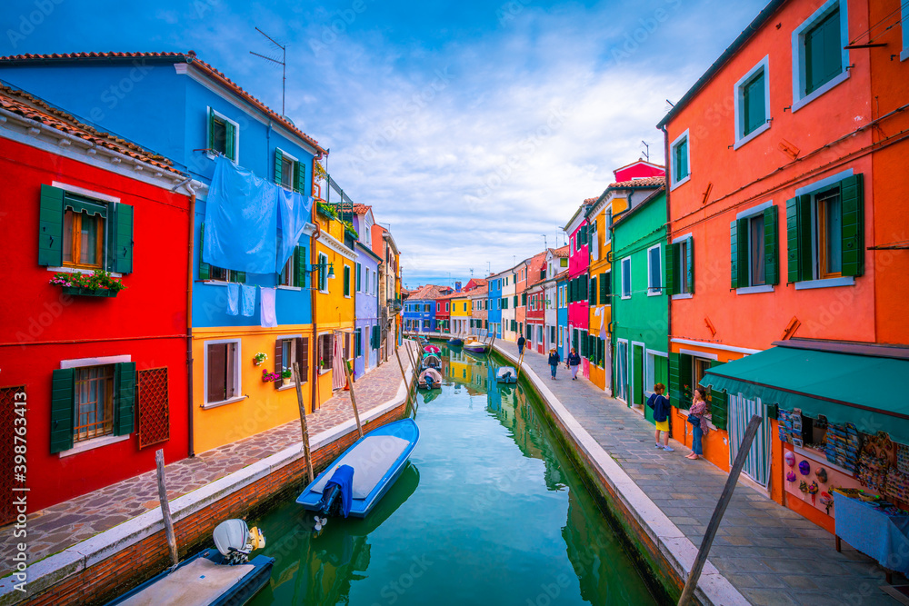 Colourful Burano island with unidentified tourists near Venice, Italy