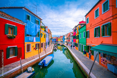 Colourful Burano island with unidentified tourists near Venice, Italy