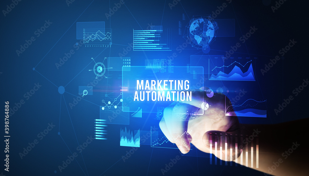 Hand touching MARKETING AUTOMATION inscription, new business technology concept Hand touching MARKETING AUTOMATION inscription, new business technology concept