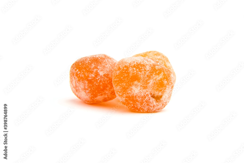 Dried fruits, two candied kumquats isolated on white background Dried fruits, two candied kumquats isolated on white background