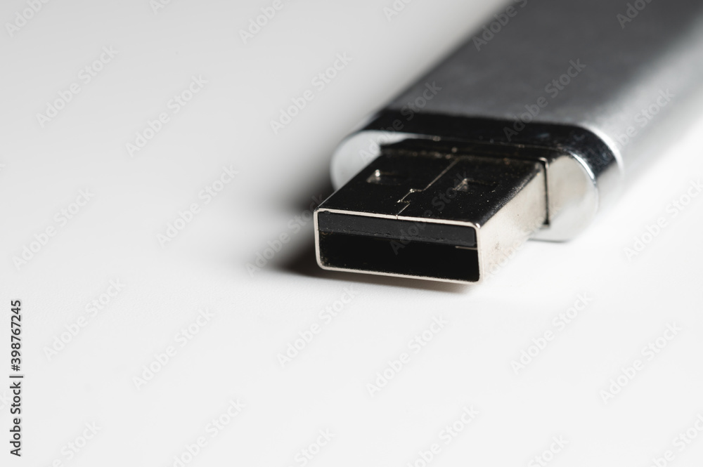 Close-up USB flash drive. Close-up on gray gradient background Close-up USB flash drive. Close-up on gray gradient background