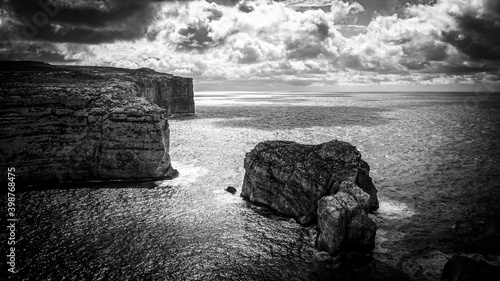 The remains of Azure Window at Dwerja Bay at the coast of Gozo Malta - aerial photography © 4kclips