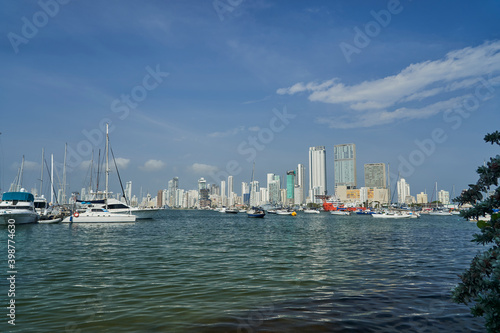 Skyline of Cartagena at the harbour  showing skyscrapers and yachts in the clear water of the caribbean sea