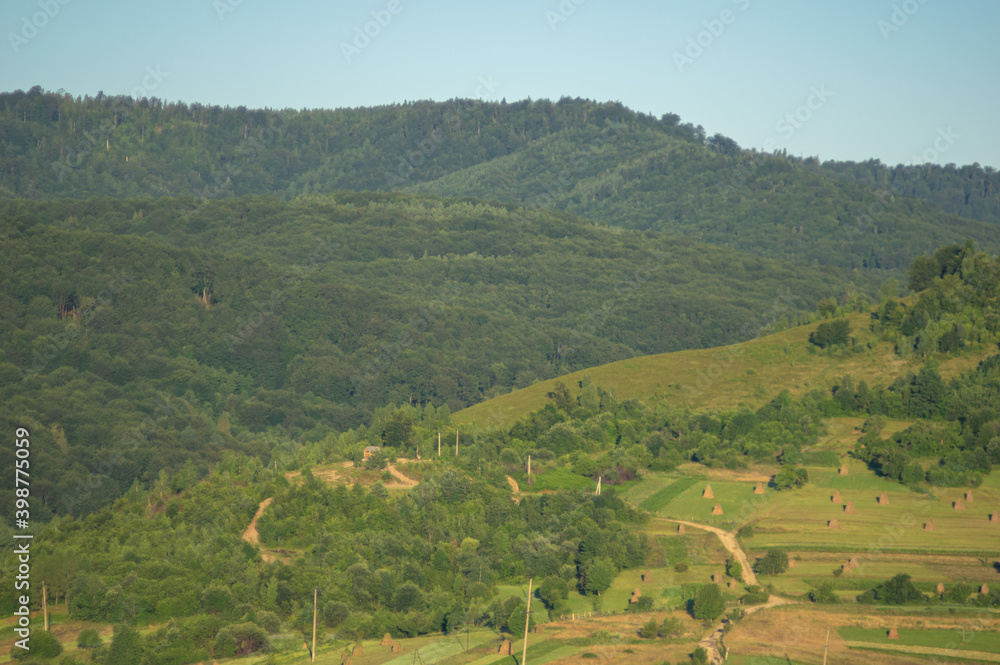 Fototapeta premium Panorama of the village in the autumn morning among the mountains
