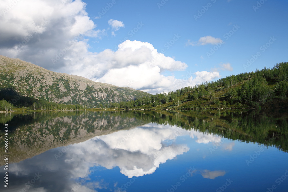 clouds over the mountain lake