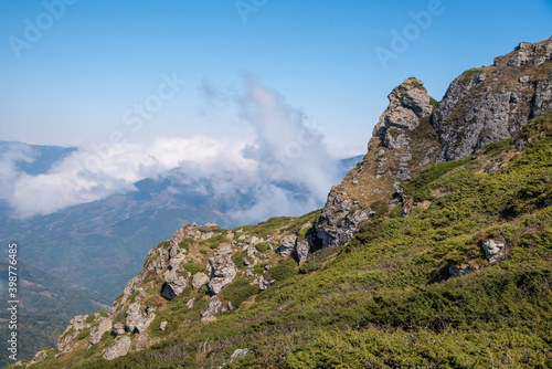 View from the top of Babin zub (The Grandmather's tooth) on Old mountain, which is the most beautiful peak of Stara planina ( Balkan mountains).The impressive and big striking rocks and dense plants.