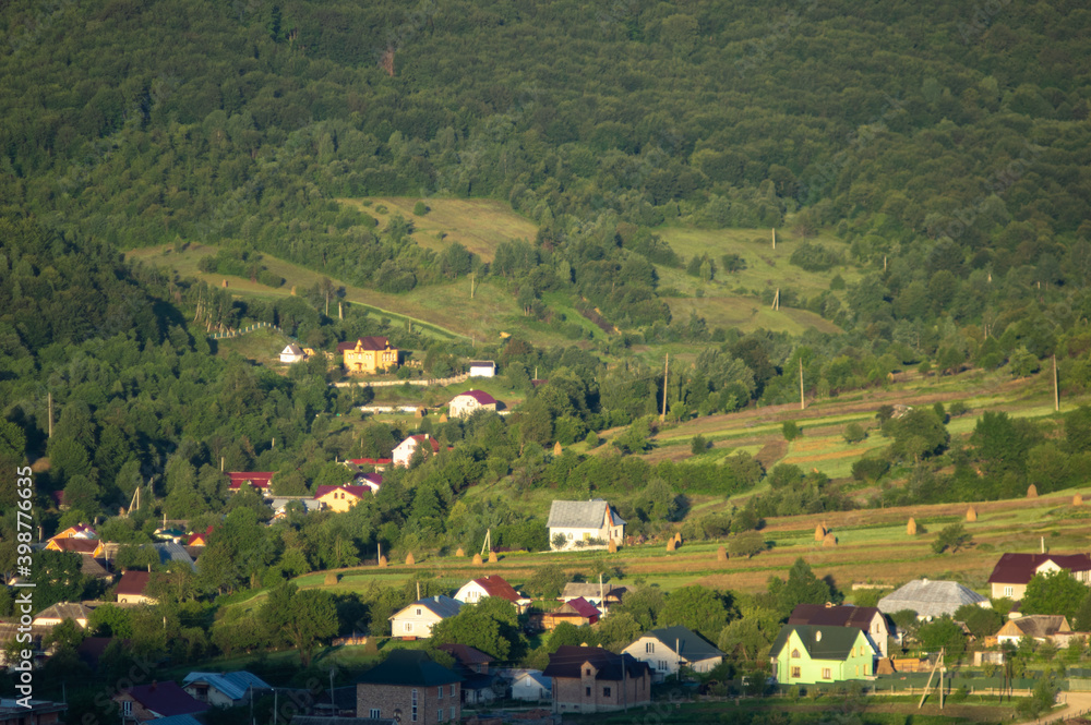 Naklejka premium Panorama of the village in the autumn morning among the mountains