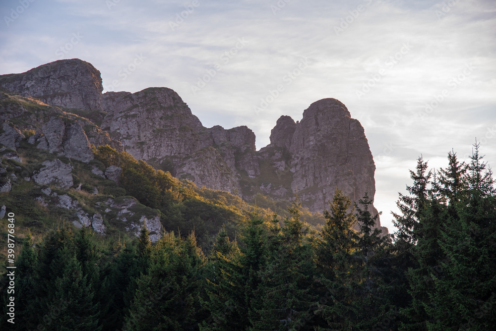 Obraz premium Babin zub (The Grandmather's tooth) on Old mountain, which is the most beautiful peak of Stara planina ( Balkan mountains). The impressive and big striking rocks and dense plants on the top. Serbia
