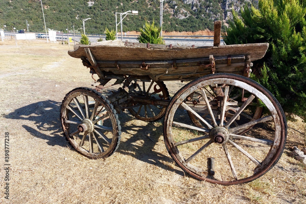 Old wooden Turkish cart. A cart with large wheels from the last century.