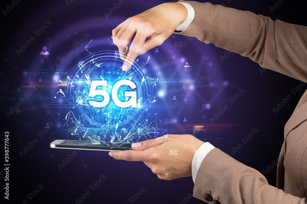 Close-up of a touchscreen with 5G abbreviation, modern technology concept Close-up of a touchscreen with 5G abbreviation, modern technology concept