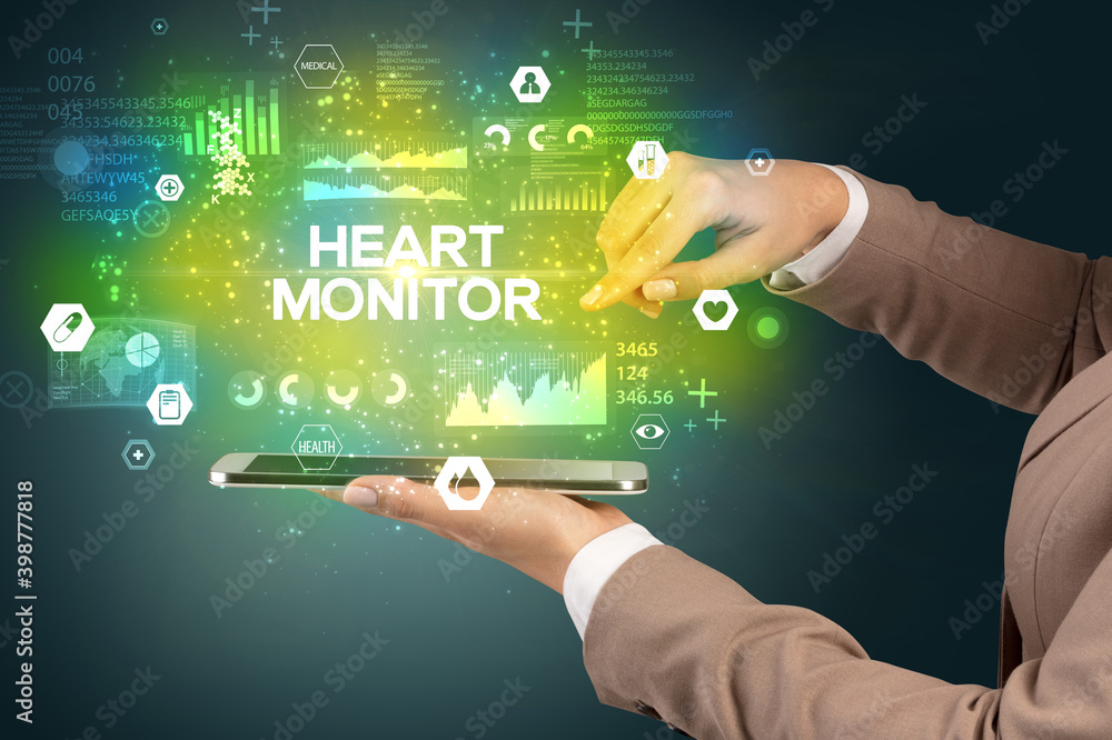 Close-up of a touchscreen with HEART MONITOR inscription, medical concept Close-up of a touchscreen with HEART MONITOR inscription, medical concept