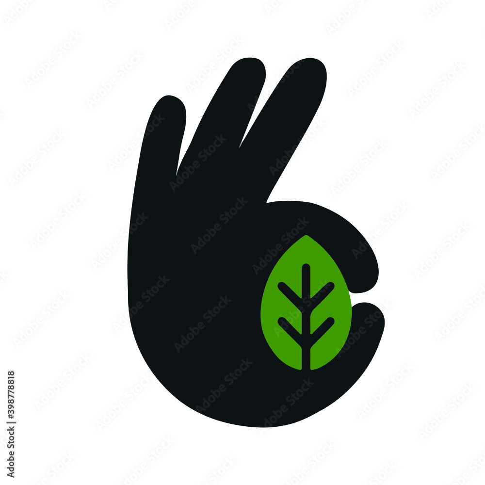 Obraz premium hand holds a leaf in the shape of an okay sign 