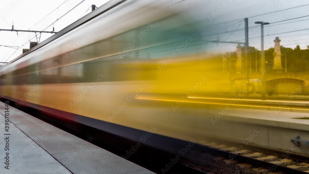 Train passing at high-speed in the station, arriving or departing, metro station