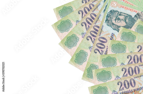 200 Hungarian forint bills lies isolated on white background with copy space. Rich life conceptual background photo