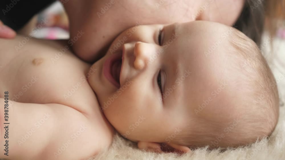 mom woman hugs hugging kissing kisses laughing smiling baby toddler mom woman hugs hugging kissing kisses laughing smiling baby toddler