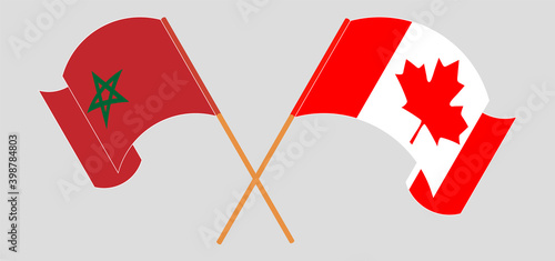 Crossed and waving flags of Morocco and Canada