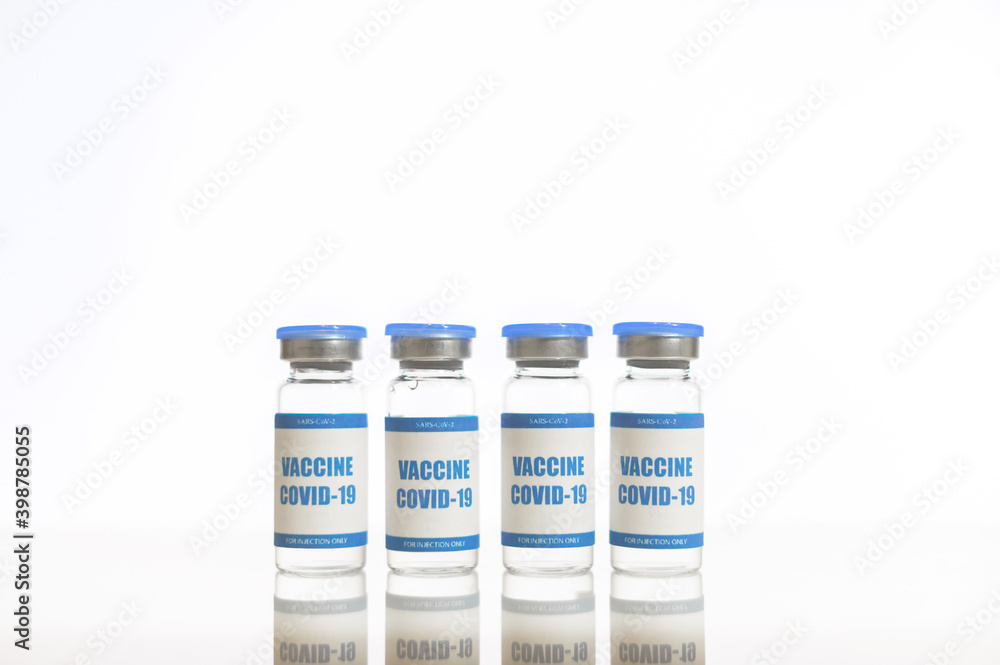Little bottles of covid, sars vaccine on the white background. Confronting the worldwide outspread of coronavirus concept Little bottles of covid, sars vaccine on the white background. Confronting the worldwide outspread of coronavirus concept