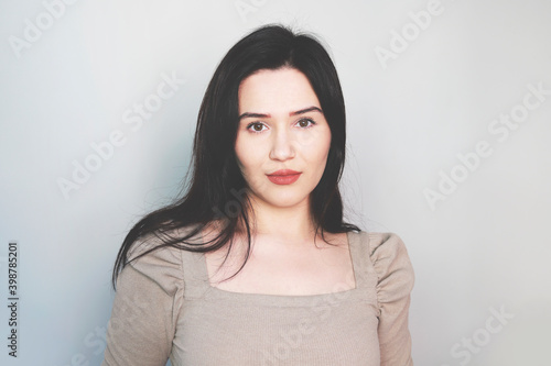 portrait of young woman looks in camera