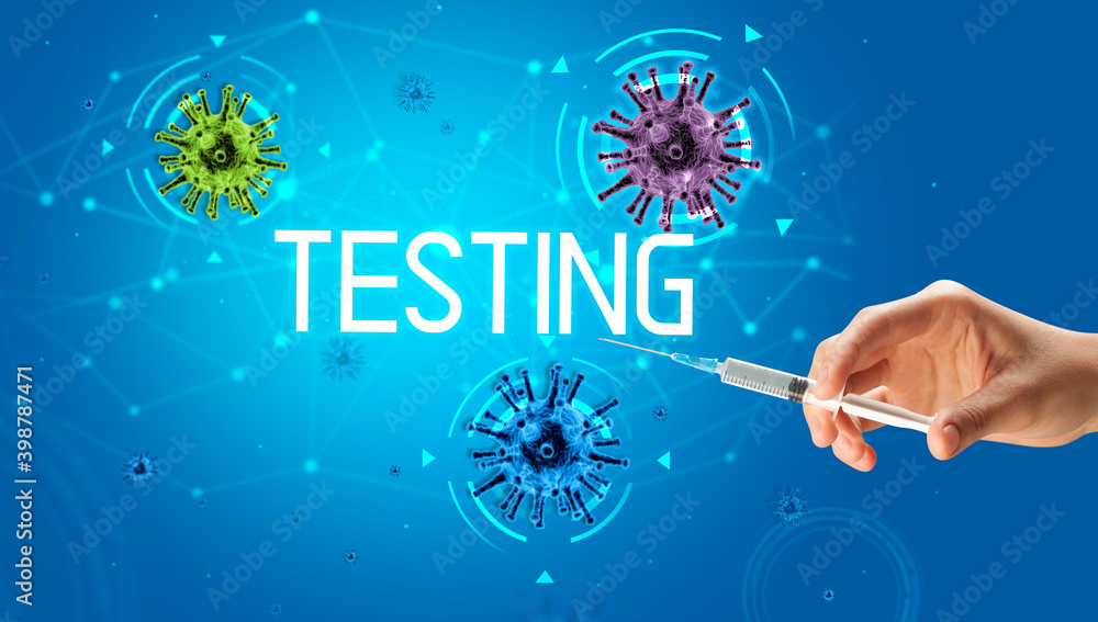 Syringe, medical injection in hand with TESTING inscription, coronavirus vaccine concept Syringe, medical injection in hand with TESTING inscription, coronavirus vaccine concept