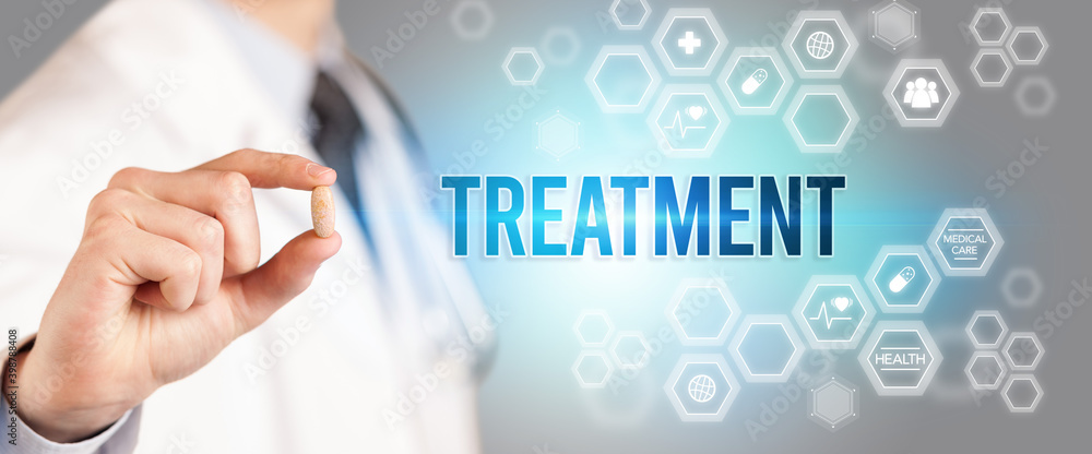 Close-up of a doctor giving you a pill with TREATMENT inscription, medical concept Close-up of a doctor giving you a pill with TREATMENT inscription, medical concept