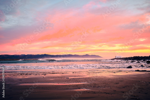 Fototapeta Naklejka Na Ścianę i Meble -  Sunset surf warning, mega waves, beautiful sky, pure power. 