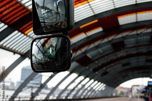 Photography Closeup of a bus mirror at the bus station of Amsterdam