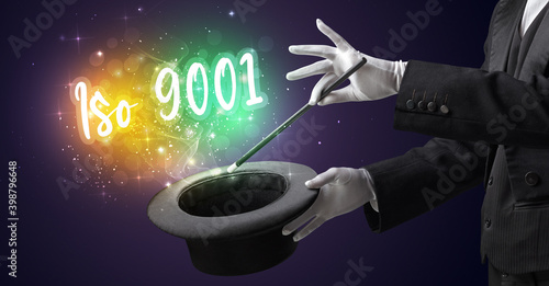 Magician hand conjure with wand and Iso 9001 inscription, shopping concept