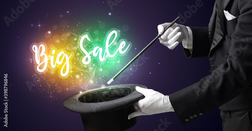 Magician hand conjure with wand and Big Sale inscription, shopping concept