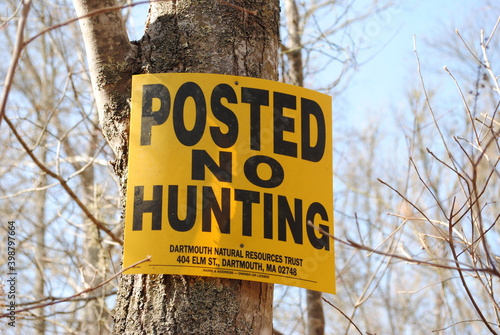 Yellow sign with black lettering reading 