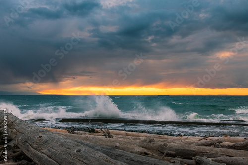 Waves splashing at Whidbey Island beach during sunset © TSchofield