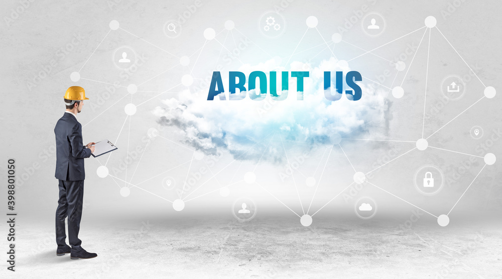 Engineer working on a social media concept with ABOUT US inscription Engineer working on a social media concept with ABOUT US inscription