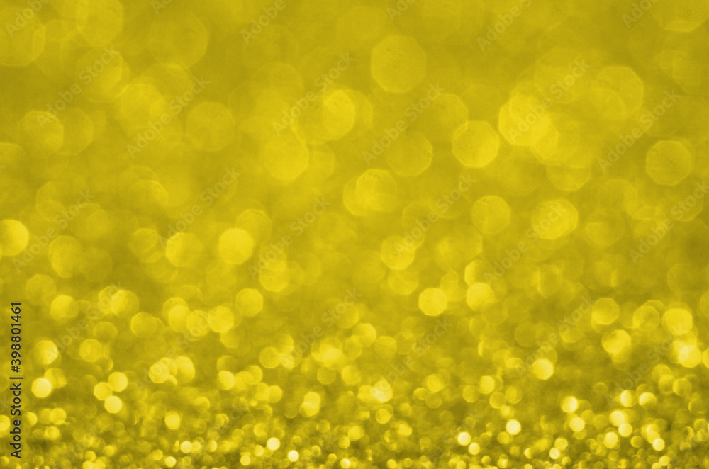 Illuminating Pantone Color Of The Year 2021. Abstract festive bokeh background with shining defocus sparkles. Blurred glitters shimmering dust macro close up, copy space for text logo Illuminating Pantone Color Of The Year 2021. Abstract festive bokeh background with shining defocus sparkles. Blurred glitters shimmering dust macro close up, copy space for text logo
