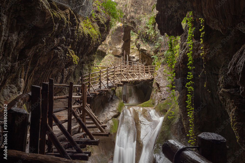 Obraz premium Stalactites and waterfalls in caves carved out of sandstone, Caglieron caves, Veneto, Italy