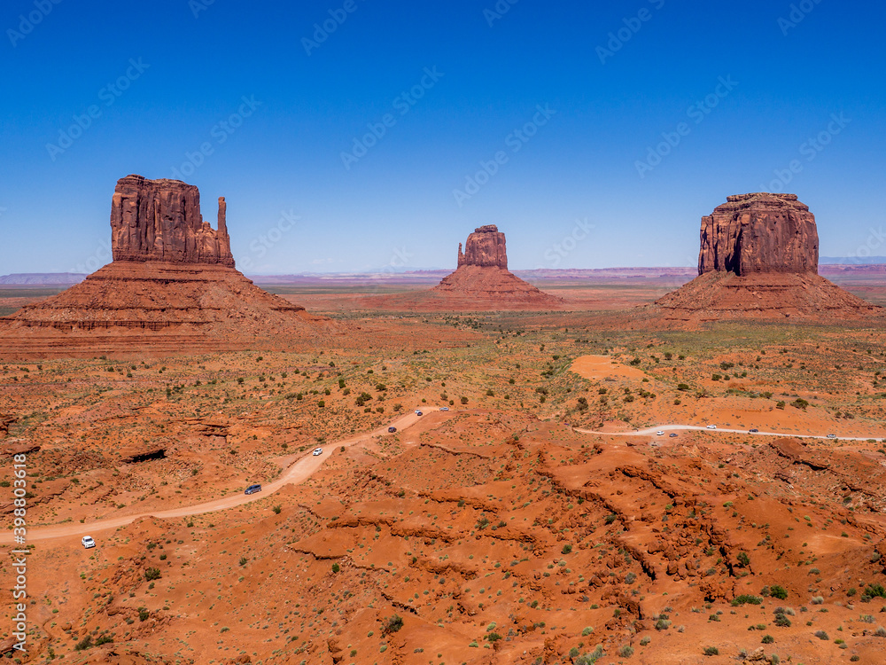 Panoramic view of Monument Valley, Utah, USA during a hot sunny day with the view of West Mitten Butte, East Mitten Butte and Merrick Butte Panoramic view of Monument Valley, Utah, USA during a hot sunny day with the view of West Mitten Butte, East Mitten Butte and Merrick Butte