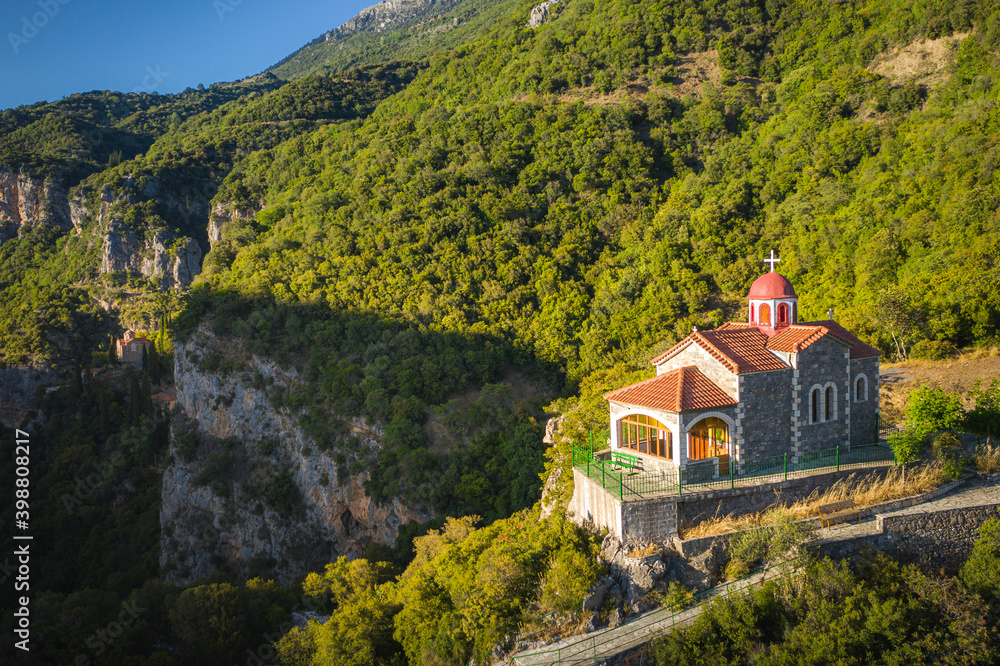 Scenic Orthodox Monastery (Moni Agiou Ioannou Prodromou) built inside rocky mountain.