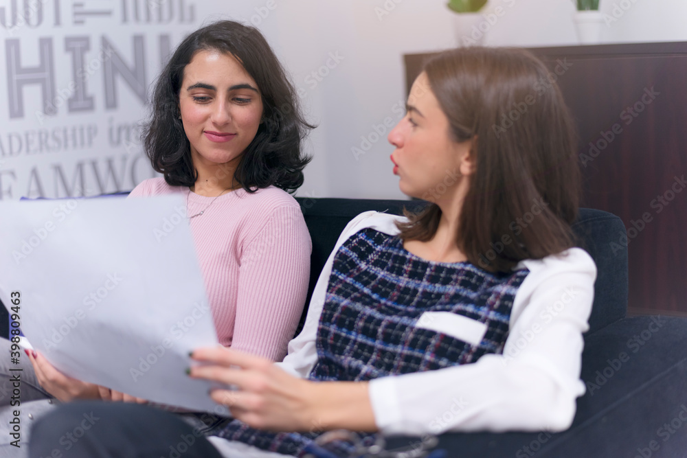 Young multiracial and multiethnic team of Business experts working together on important financial report. Economy and business concept Young multiracial and multiethnic team of Business experts working together on important financial report. Economy and business concept