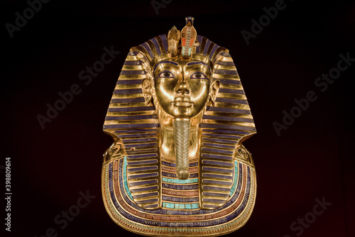 Replica of the funerary mask of Tutankhamun. Isolated on black background