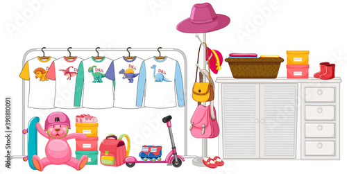 Children clothes hanging on clothes rack with accessories on white background