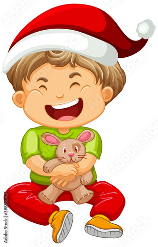 Cute boy wearing Christmas hat and playing with his toy on white background