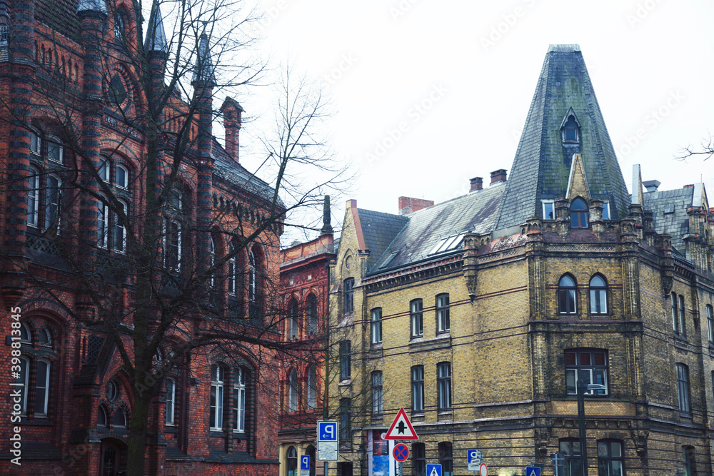 Fototapeta premium Post card view amber house in Germany Hamburg, european street and roofs