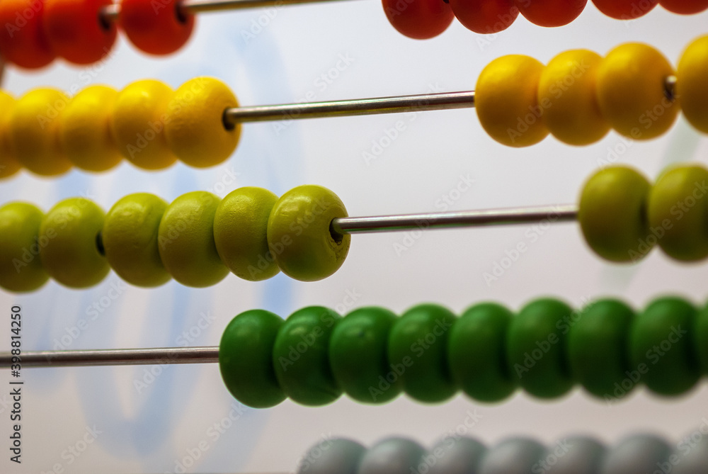 Close up of children's abacus with wooden beads of different colors Close up of children's abacus with wooden beads of different colors