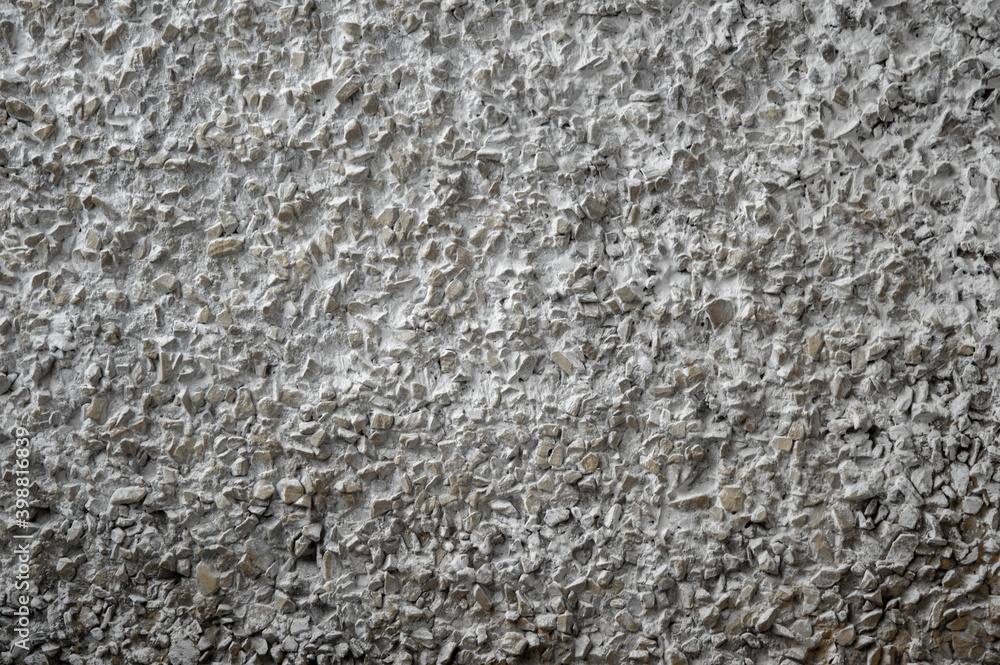 decorative coating with fine stone abrasive, dark background decorative coating with fine stone abrasive, dark background