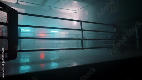 Boxer in the boxing gym. Bandages his hands. Sparring in the ring. Boxer jumping rope. Exercise with ropes. Round one. Fog in the ring. Zetsky sport. Beautiful backlight. World boxing champion.

 photo