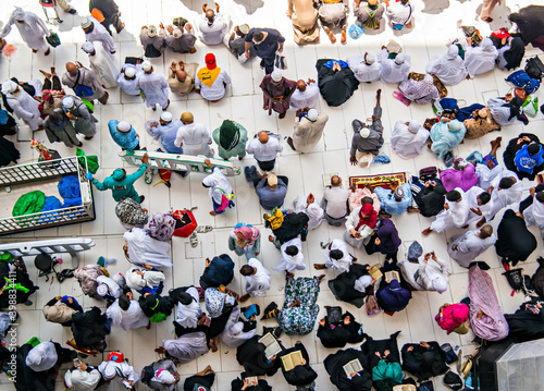 Muslim pilgrims from all around the world doing tawaf, praying around the kabah, during hajj and umra 2018 period. photo