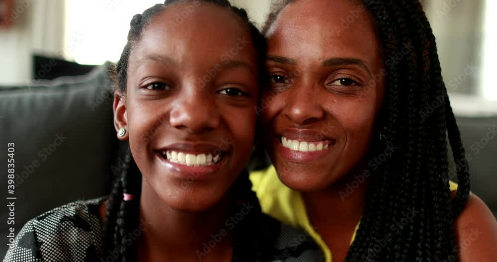 Mixed race mother and teenage girl daughter smiling at , Portrait African portrait faces Mixed race mother and teenage girl daughter smiling at , Portrait African portrait faces