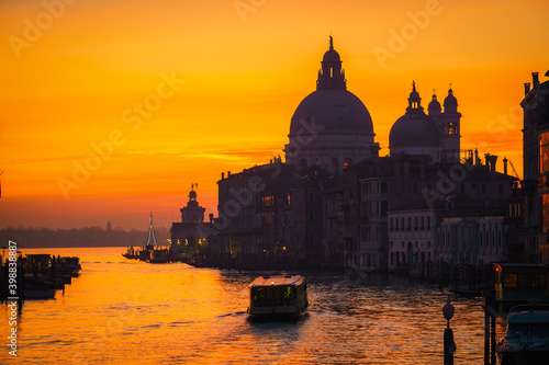 Beautiful sunrise silhouette of Grand Canal and Basilica Santa Maria della Salute in Venice, Italy
