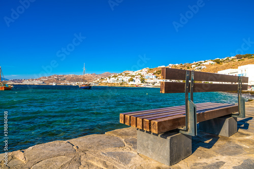 Empty bench at the sea coast of Mykonos island,Greece